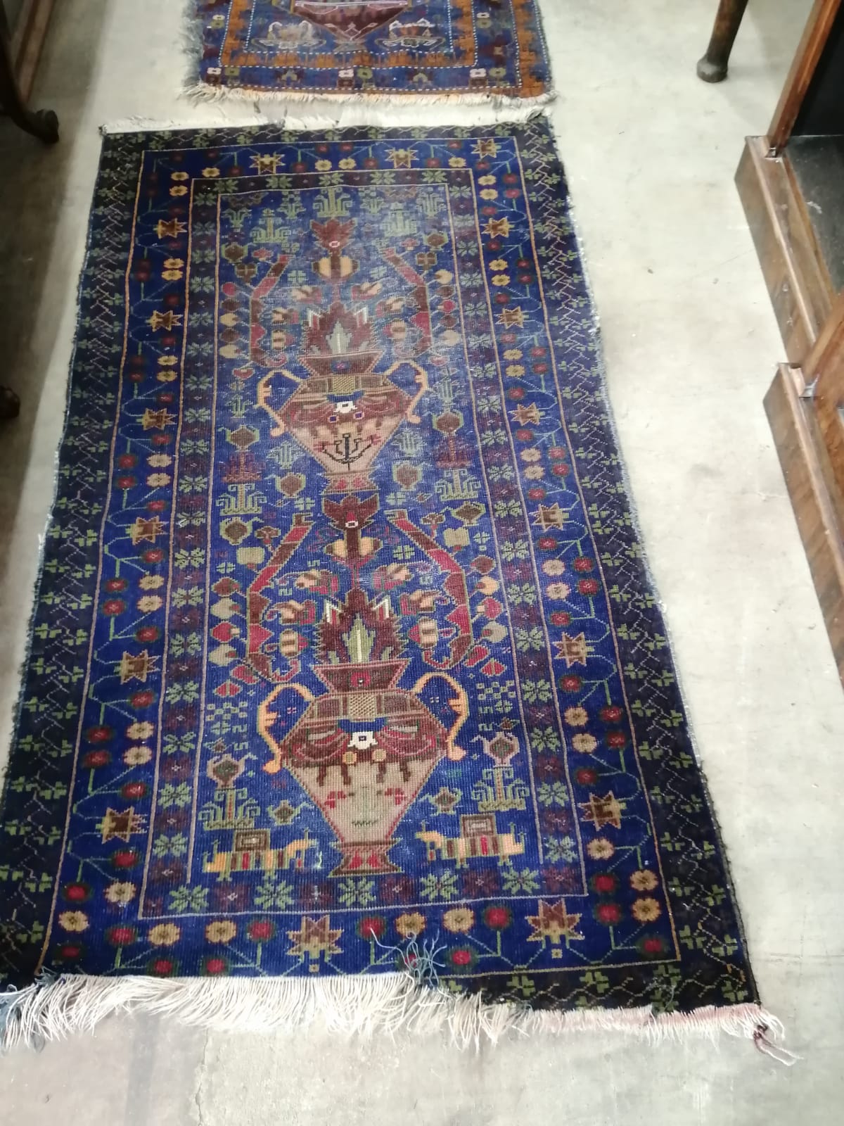 A Caucasian blue ground carpet, approx. 290 x 162cm together with a near pair of smaller North West Persian blue ground rugs